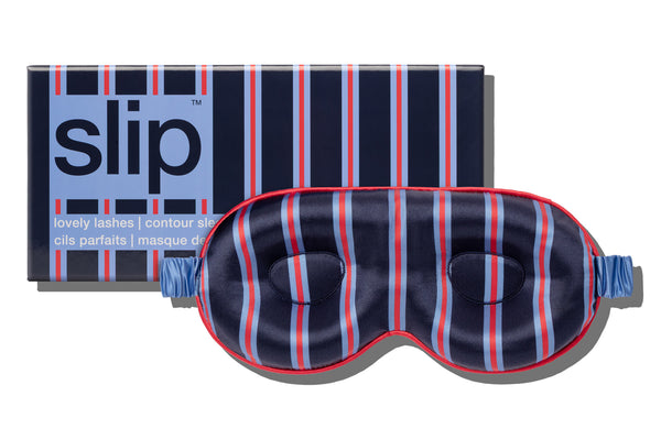 Striped navy, blue and red silk contour sleep mask with 'slip' packaging on a white background